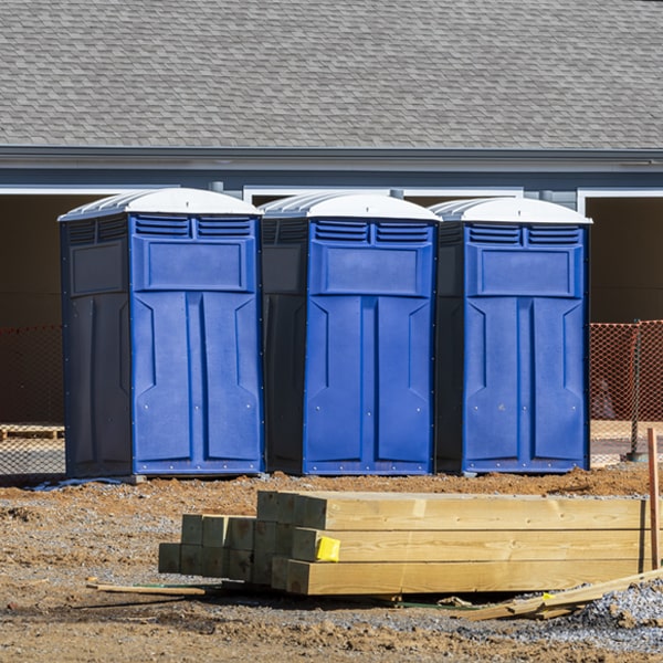 what is the cost difference between standard and deluxe portable toilet rentals in Moncure